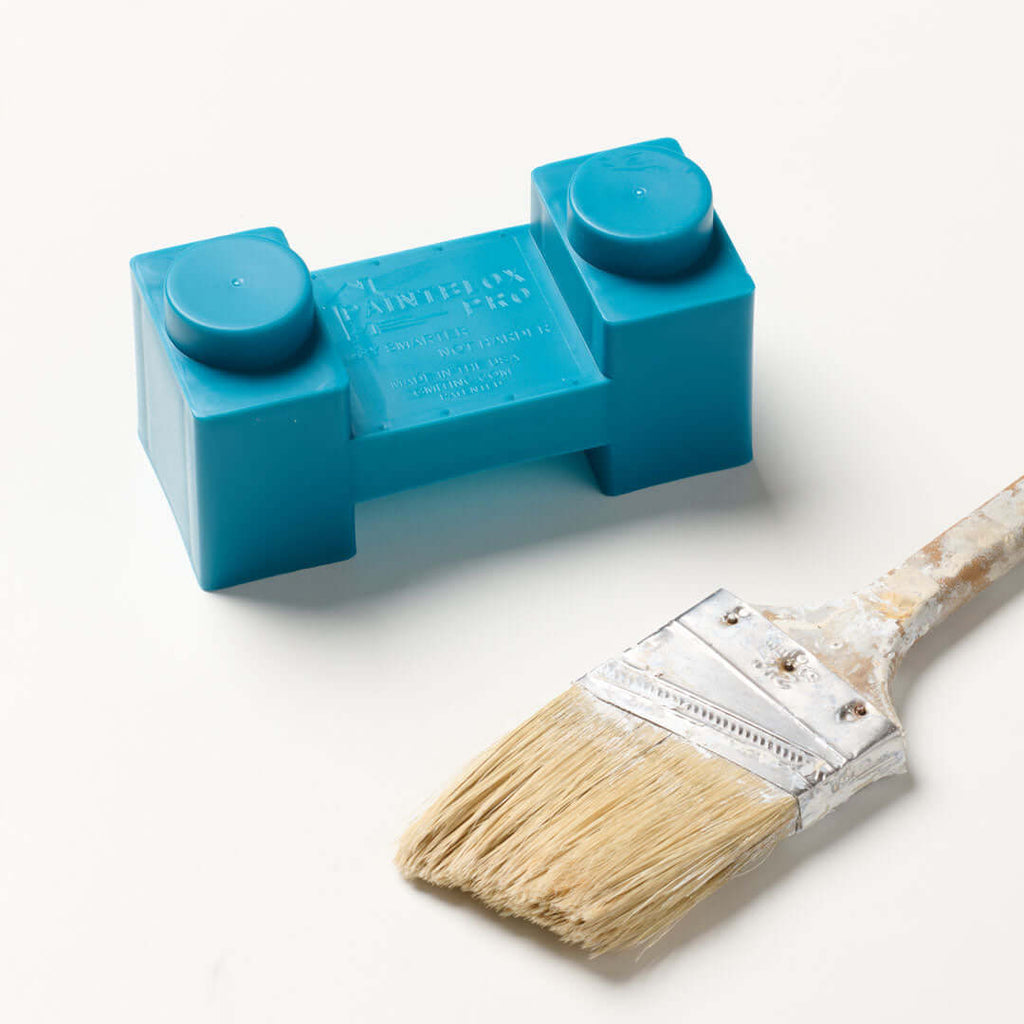 Pro 48 drying rack with modular support block and paint brush on a light background.