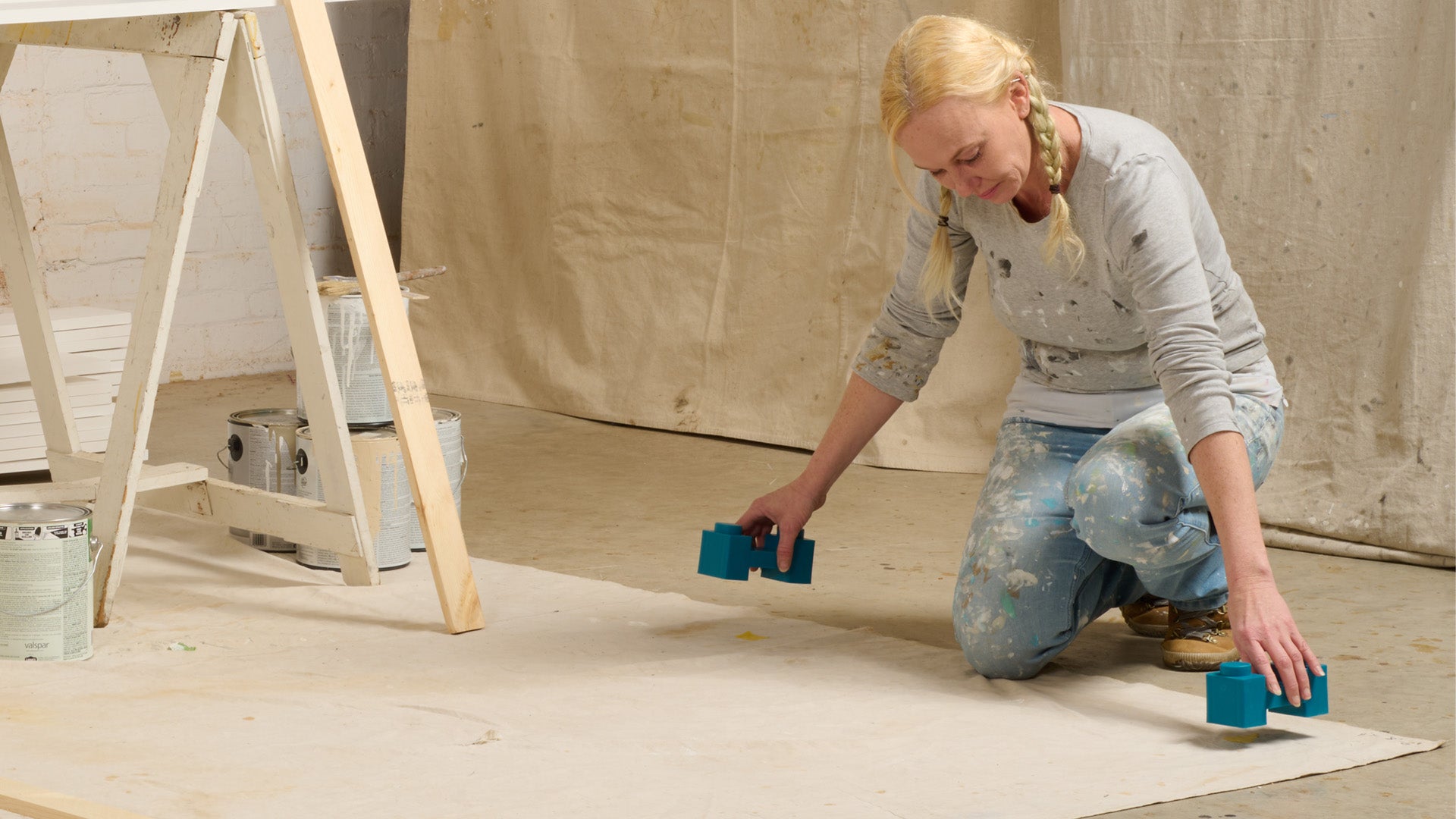 Painter laying down PaintBlox.