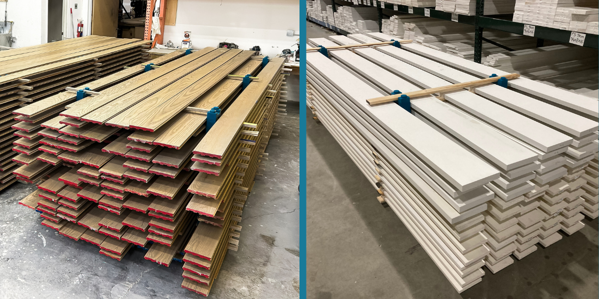 16 ft solid oak tongue-and-groove and 12 ft primed trim drying in tall stacks on PaintBlox Pro supports