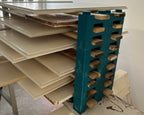 A professional cabinet door drying rack built with PaintBlox Pro Crew 72 blocks, stacking freshly painted cabinet doors.